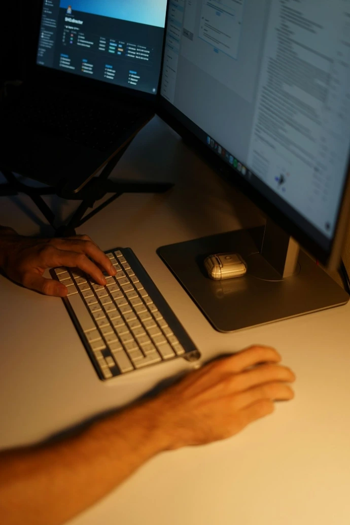 person using white computer keyboard